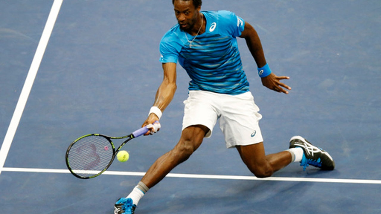 The Latest: Lopez team knocks out Bryan brothers at US Open